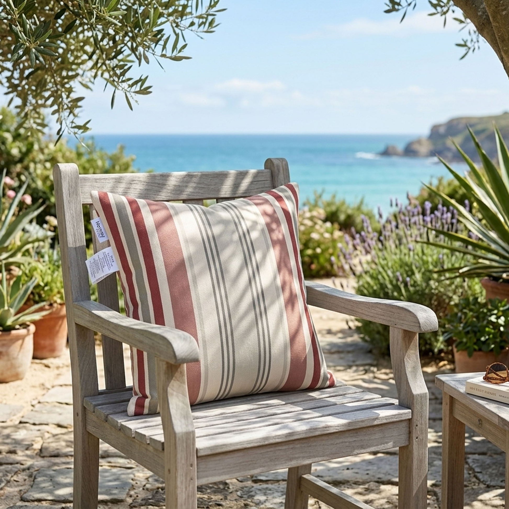Wooden chair with a striped cushion in a garden setting with ocean view